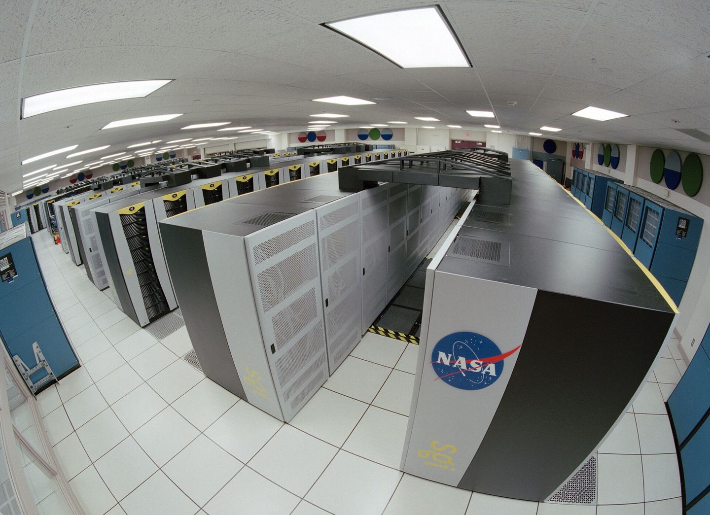 Rows of computing cabinets filling the hall of a supercomputing facility.